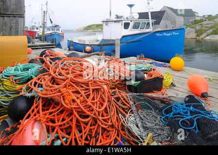 Mooring ropes and nets on a fishing boat. Accessories needed for fishing.  Spring season Stock Photo - Alamy