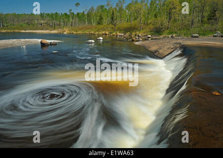 Swirling waters the Whiteshell River as they flow into White Lake at Rainbow Falls Whiteshell Provincial Park Manitoba Canada Stock Photo