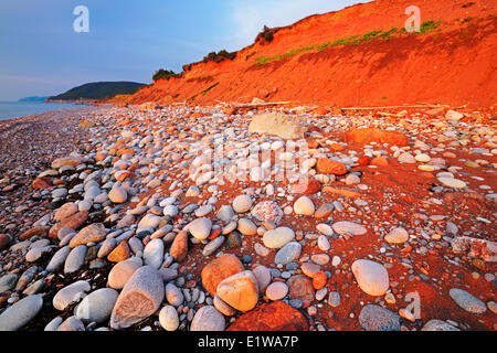 Rocky shoreline at sunset, Pleasant Bay, Cape Breton Island, Nova Scotia, Canada Stock Photo