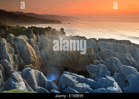 Sunset at the Pancake Rocks at Punakaiki, West Coast, South Island, New Zealand. Stock Photo