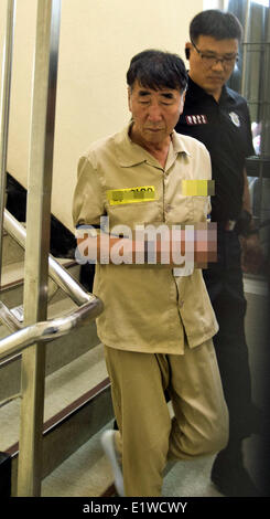 Seoul, South Korea. 10th June, 2014. 68-year-old captain Lee Joon-seok is seen during a trial at the Gwangju District Court in the southwestern South Korean city of Gwangju on June 10, 2014. The trial opened on Tuesday for the captain and three crew members of the sunken ferry ' Sewol' with murder as they abandoned the ship without helping rescue or evacuate hundreds of passengers. Credit:  NEWSIS/Xinhua/Alamy Live News Stock Photo