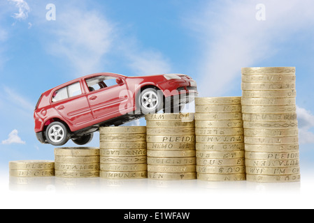 a red car climbing up a money chart isolated on a white background Stock Photo
