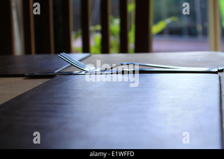 A place setting in a public house dining room table Stock Photo