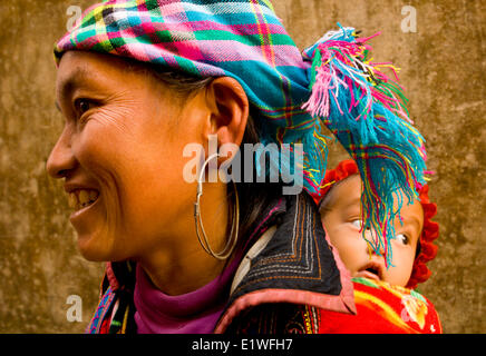 Hmong woman with her baby in Sapa, Vietnam Stock Photo