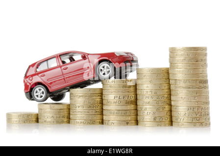 a red car climbing up a money chart isolated on a white background Stock Photo