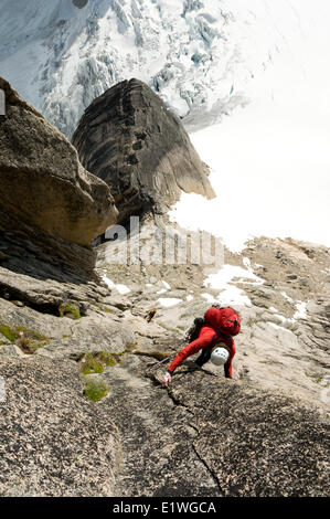 Two climbers ascent Surf's Up, a rock-climbing route on Snowpatch Spire, Bugaboos, British Columbia Stock Photo