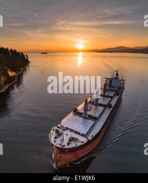Freighter passing under Lions Gate Bridge, Vancouver, B.C. Canada. Stock Photo