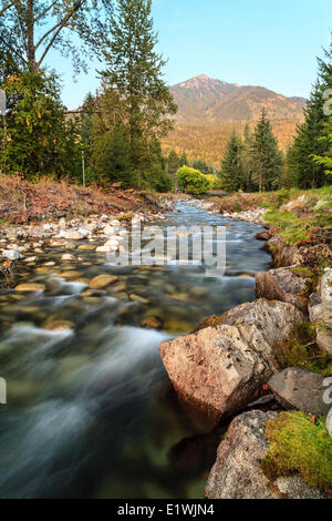 Four Mile Creek flows through Silverton, British Columbia with Idaho Peak in the background. Stock Photo