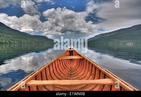 canvas canoe on Watchan Lake, British Columbia, Canada, multiple exposure, Darrel Giesbrecht Stock Photo