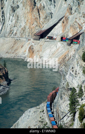 A CN container train westbound along the Thompson River, near Lytton, BC, Canada. Stock Photo