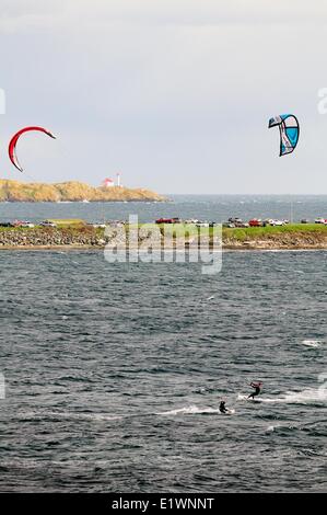 Two kite surfers surfing in the Strait of Juan De Fuca off Dallas Rd. in Victoria, BC. Stock Photo