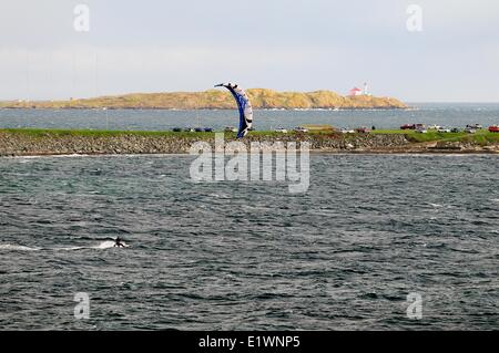 Lone kite surfer surfing in the Strait of Juan De Fuca off Dallas Rd. in Victoria, BC. Stock Photo