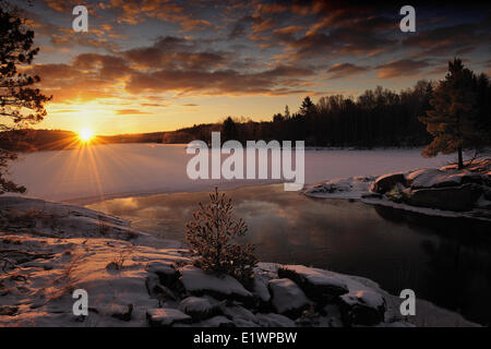 Sunrise in early spring on the Vermilion River in Northern Ontario, Canada. Stock Photo