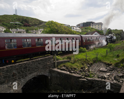 Iconic Jacobite steam train the Lancashire Fusilier leaving Mallaig village station Scottish Highlands Stock Photo