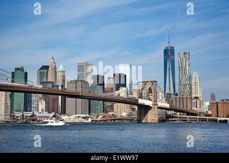 Part Manhattan that abuts the East River over which spans the Brooklyn Bridge. Photograph taken Brooklyn. New York City New Stock Photo