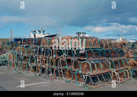 Lobster pots and ropes on the quayside at Seahouses Harbour, Northumberland. Stock Photo