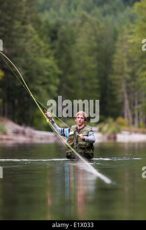 A young angler flyfishes in the Taylor River near Port Alberni.  Taylor River Port Alberni  Vancouver Island British Columbia Stock Photo