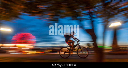 Bicyclist and Science World at dusk. Stock Photo