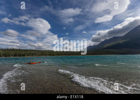 Person kayaking on Kathleen Lake with King's Throne on the far side of lake, Kluane National Park, Yukon. Stock Photo