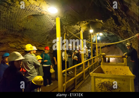 Tourists taking a tour through the Britannia Mine in Sqamish, British Columbia, Canada Stock Photo