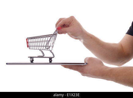online shopping concept tablet pc with shopping cart isolated on a white background Stock Photo