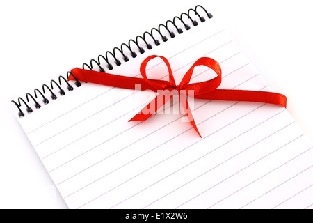 Note Pad Plus Red Notepad with red bow on a white background Stock Photo - Alamy