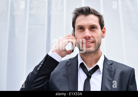 Businessman using cell phone Stock Photo
