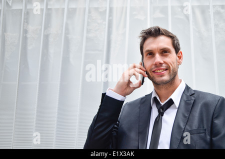Businessman using cell phone Stock Photo