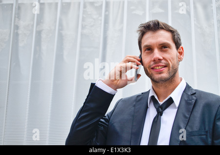 Businessman using cell phone Stock Photo