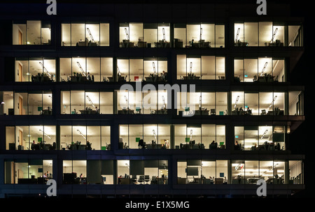 People working at night in the office block Stock Photo