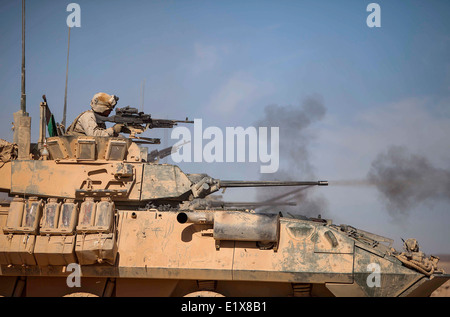 A US Marine Corps light armored vehicle assigned to the 22nd Marine Expeditionary Unit opens fire during a live-fire exercise as part of Eager Lion May 30, 2014 in Jebel Petra, Jordan Stock Photo