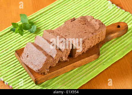 Slices of chocolate halva on cutting board Stock Photo