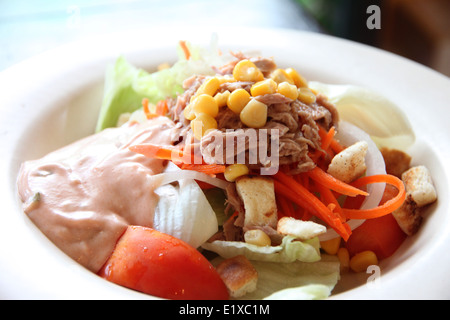 tuna and vegetable salad in dish at restaurant. Stock Photo