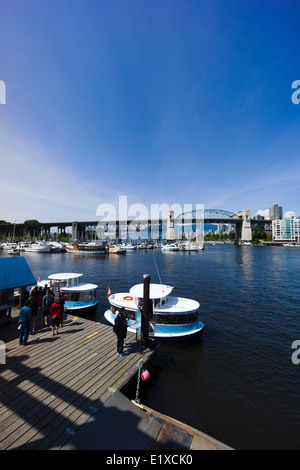 People boarding False Creek Ferries at Granville Island. Vancouver, British Columbia, Canada. Stock Photo