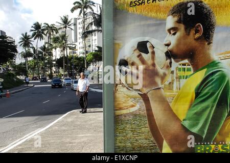 Salvador. 11th June, 2014. A man looks on an advertisement of Brazil World Cup, in Salvador Bahia, June 10 2014. the World Cup 2014 will be held in Brazil from 12 June to 13 July. © Jhon Paz/Xinhua/Alamy Live News Stock Photo