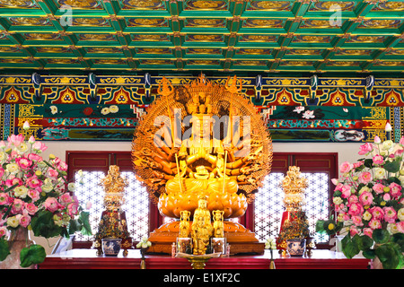 Thousand hands of god image make of wood carving in chinese temple ,Thailand. Stock Photo