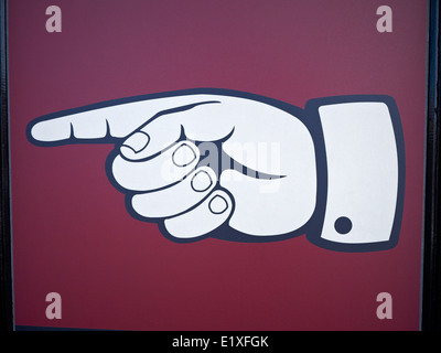 Drawing of a right hand shows the direction to the left Stock Photo