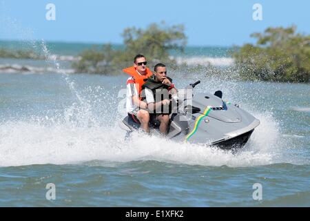 Santo Andre, Brazil. 10th June, 2014. HANDOUT - German national soccer player Miroslav Klose (L) rides on a jet ski at the sea of Santo Andre, Brazil, 10 June 2014. The FIFA World Cup will take place in Brazil from 12 June to 13 July 2014. Credit:  dpa picture alliance/Alamy Live News Stock Photo