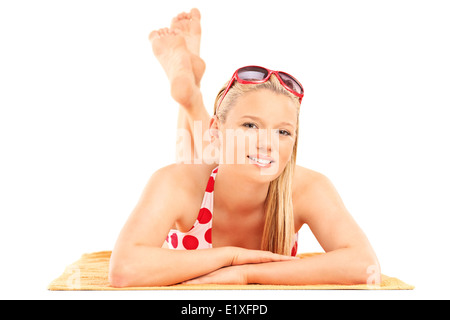 Beautiful woman in bikini lying on a towel Stock Photo
