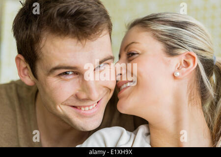 Close-up beautiful young woman kissing man Stock Photo