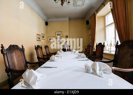 Female customer sitting at dining table in restaurant Stock Photo