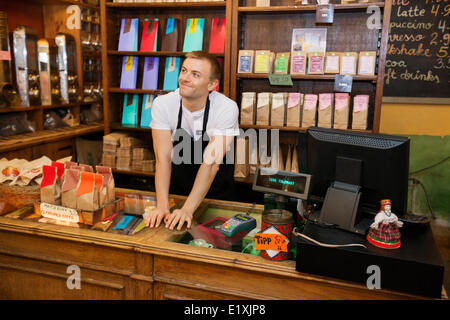 Portrait of confident salesperson in coffee store Stock Photo