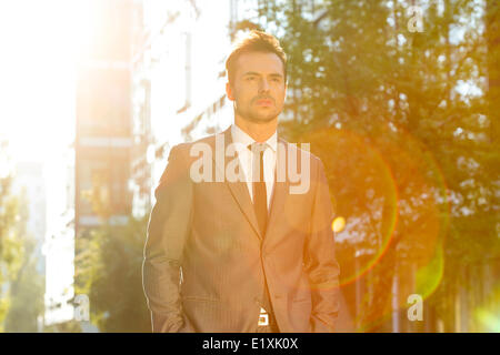 Thoughtful businessman looking away outdoors Stock Photo