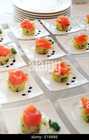 Plates of smoked salmon appetizers Stock Photo