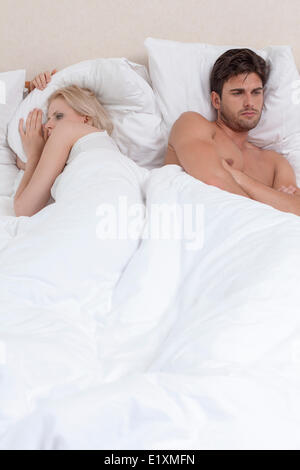 Young couple having relationship difficulties in hotel room Stock Photo