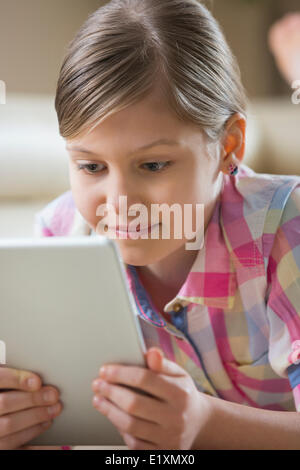 Close-up of girl using digital tablet at home Stock Photo