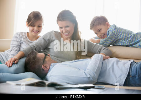 Happy family in living room Stock Photo