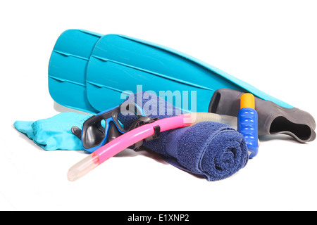 Flippers, snorkel, towel, suntan lotion and a swimsuit on white Stock Photo