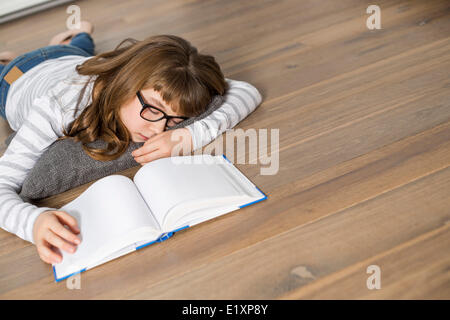 High angle view of teenage girl sleeping while studying on floor Stock Photo