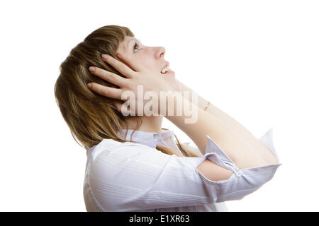 young girl looks up in horror Stock Photo